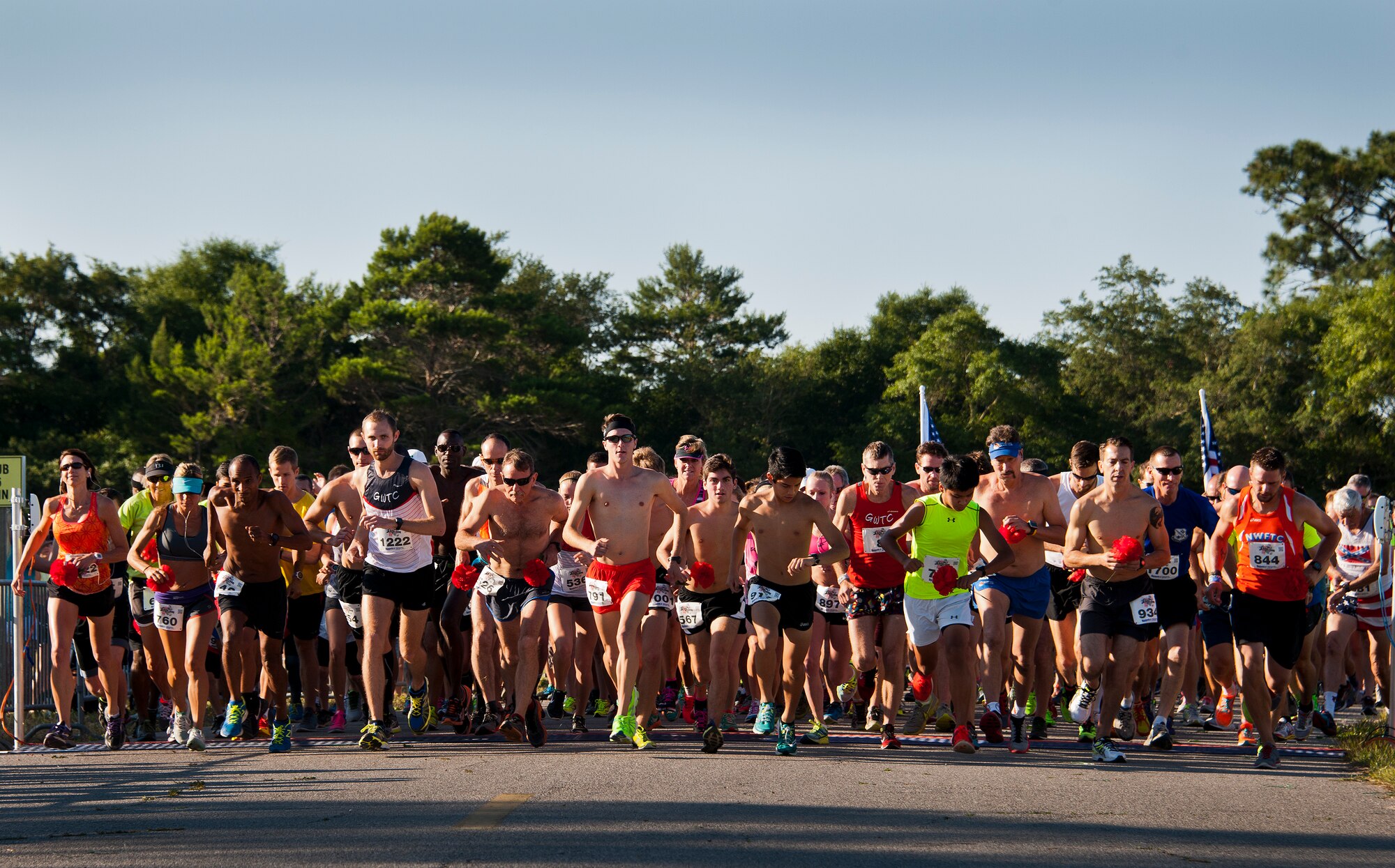Runners cross the start line at the 30th Anniversary Memorial Gate to Gate run May 23 at Eglin Air Force Base, Fla.  More than 1,500 participated in this year’s event.  (U.S. Air Force photo/Samuel King Jr.)