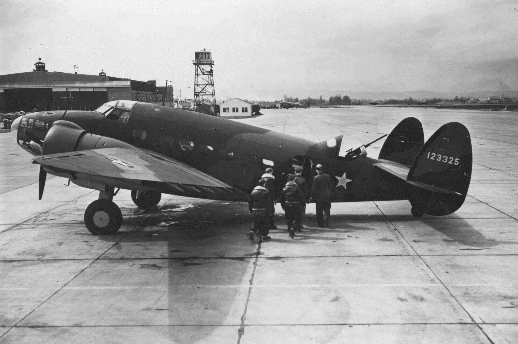 An aircrew, possibly of the 75th Bomb Squadron, prepares to board a USAAF Lockheed A-29, serial number 41-23325, at Portland Army Air Base, Oregon, circa 1942.  Note the semi-enclosed aerial gunner position at the top rear of the fuselage.  The aircraft’s RAF serial number, BW463, is barely seen in shadow on the lower rear fuselage, a remnant of the original Lend-Lease contract for the aircraft.  (USAF Photo) 