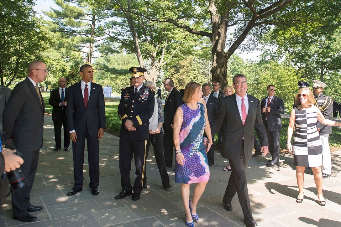 Defense Secretary Ash Carter and his wife, Stephanie, attend a ceremony at Arlington National Cemetery in Arlington, Va., where President Barack Obama placed a wreath at the Tomb of the Unknown Soldier to observe Memorial Day, May 25, 2015.