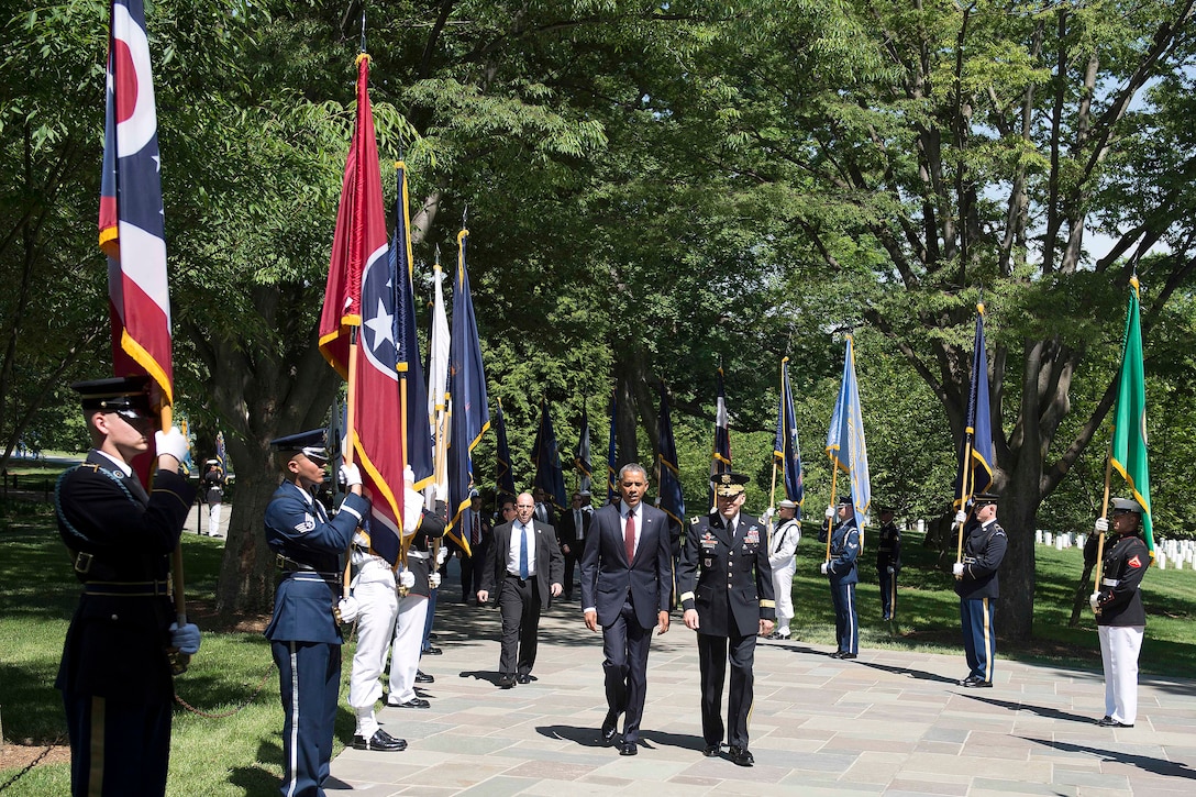 President Barack Obama arrives at Arlington National Cemetery in Arlington, Va., to lay a wreath at the Tomb of the Unknown Soldier to observe Memorial Day, May 25, 2015.