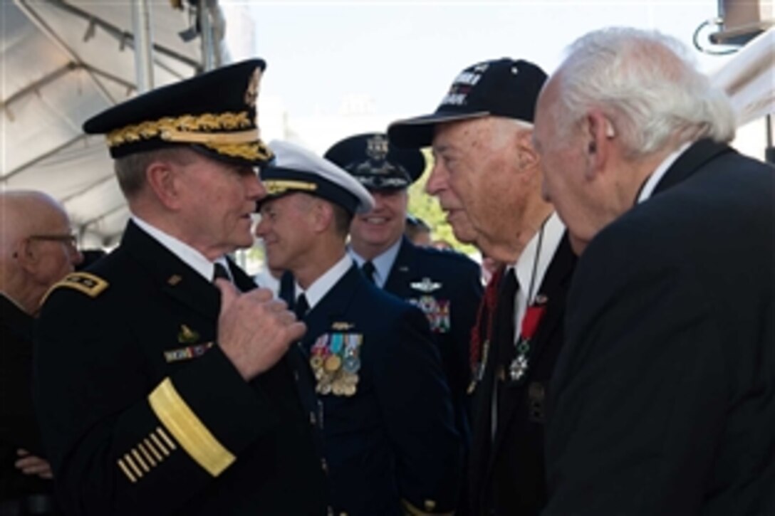 Army Gen. Martin E. Dempsey, chairman of the Joint Chiefs of Staff, greets World War II veterans at the 26th National Memorial Day Concert on the West Lawn of the U.S. Capitol in Washington, D.C., May 24, 2015. The concert included musical performances, documentary footage and dramatic readings in remembrance and appreciation of the fallen.