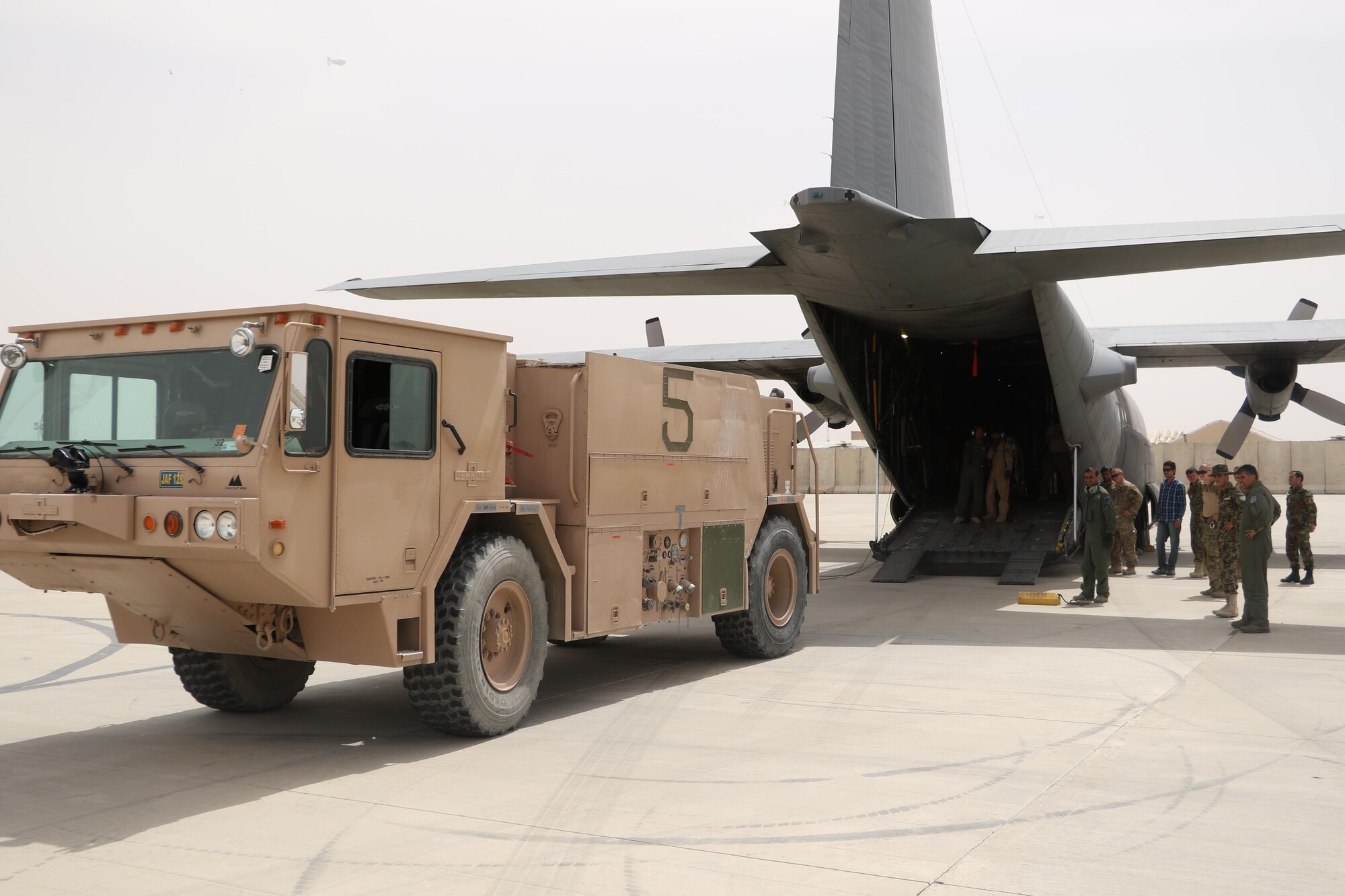 Afghan Air Force loadmasters along with Train, Advise, Assist Command - Air advisers safely loaded a P-19 firetruck onto an Afghan Air Force C-130 at Kandahar Air Wing, May 6, 2015. The team transported the firetruck from Kandahar to Herat to meet a critical need and creating an organic firefighting capability at the new location. (Courtesy photo)