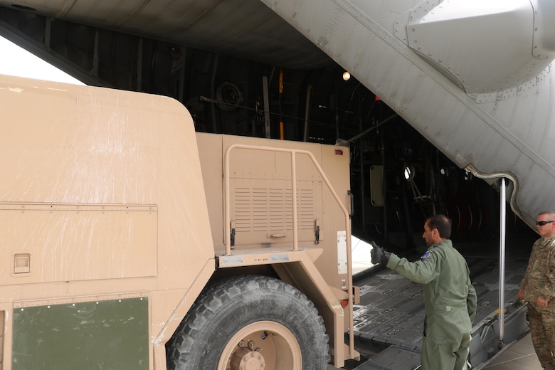 Afghan Air Force loadmasters along with Train, Advise, Assist Command - Air advisers safely loaded a P-19 firetruck onto an Afghan Air Force C-130 at Kandahar Air Wing, May 6, 2015. The team transported the firetruck from Kandahar to Herat to meet a critical need and creating an organic firefighting capability at the new location. (Courtesy photo)