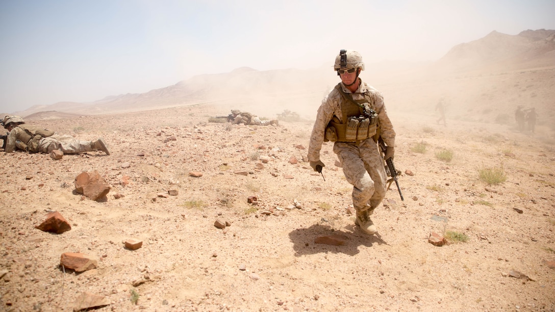 Lance Cpl. Anthony Ayr, a squad leader with Easy Co., 2nd Battalion, 2nd Marine Regiment, and a Brooklyn, N.Y., native, directs his squad to fire on targets during the last live-fire event of Eager Lion 15 around Al Quweyrah, Jordan, May 19, 2015.  Exercise Eager Lion 15 is a multinational exercise designed to strengthen military-to-military relationships, increase interoperability between partner nations, and enhance regional security and stability. Eager Lion takes place annually in the Hashemite Kingdom of Jordan, with more than 10,000 military participants from 18 countries and NATO. 