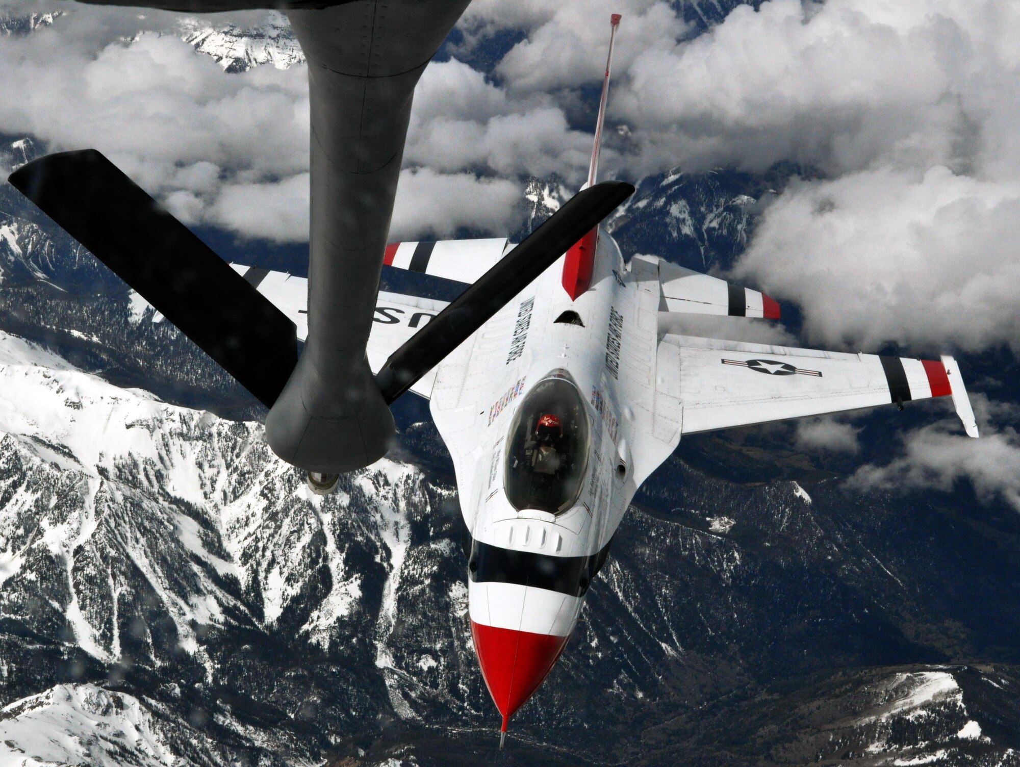 Capt. Nicholas Eberling, a solo pilot for the U.S. Air Force Thunderbirds Air Demonstration Squadron, maneuvers his F-16 Fighting Falcon aircraft to close in on the refueling boom of a KC-135 Stratotanker from McConnell Air Force Base, Kan., May 21, 2015. The KC-135 was one of two McConnell tankers providing cross-country air refueling support for the Thunderbirds. The KC-135 aircrews, all Air Force Reservists from the 931st Air Refueling Group, provided several air refuelings for the Thunderbirds, taking them from Nellis AFB, Nev., to Long Island MacArthur Airport, Islip, N.Y., ensuring the demonstration team made it to their May 23 flight demonstration at the Jones Beach Air Show in Wantagh, N.Y. (U.S. Air Force photo by Capt. Zach Anderson)
