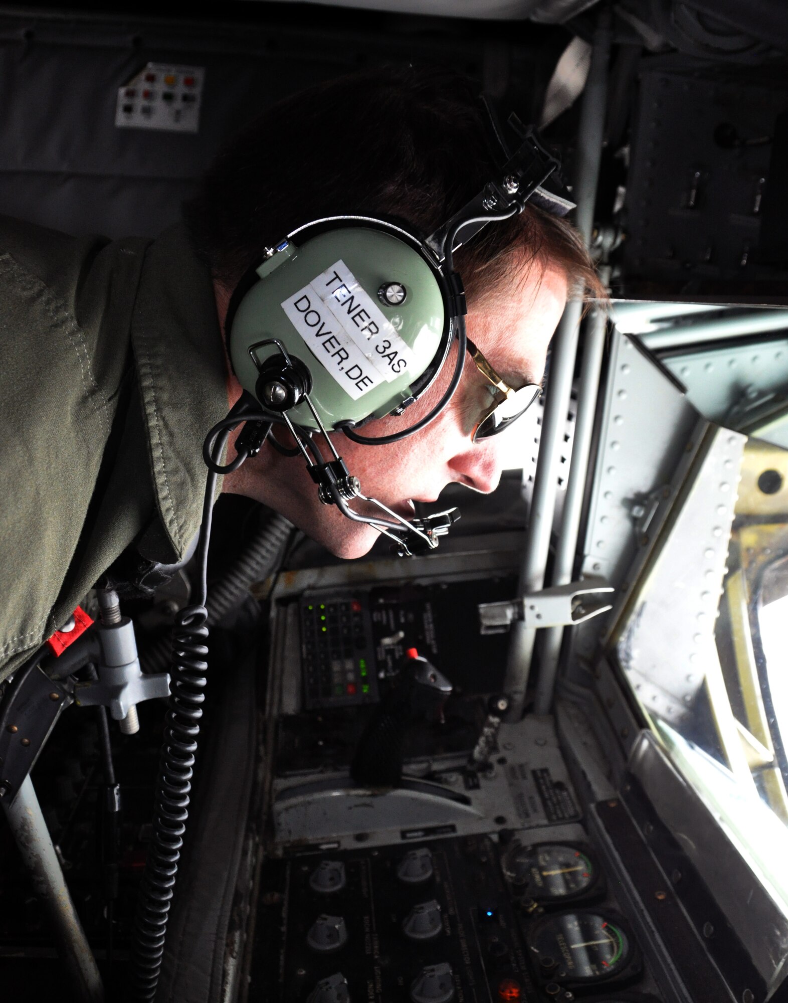 Tech. Sgt. Matthew Tener, a refueling boom operator assigned to the Air Force Reserve 18th Air Refueling Squadron, 931st Air Refueling Group, peers through the window of the boom pod of a KC-135 Stratotanker while refueling an F-16 Fighting Falcon from the U.S. Air Force Thunderbirds Demonstration Squadron, May 21, 2015. The KC-135 was one of two McConnell Air Force Base tankers providing cross-country air refueling support for the Thunderbirds. The KC-135 aircrews, all Air Force Reservists from the 931st Air Refueling Group, provided several air refuelings for the Thunderbirds, taking them from Nellis AFB, Nev., to Long Island MacArthur Airport, Islip, N.Y., ensuring the demonstration team made it to their May 23 flight demonstration at the Jones Beach Air Show in Wantagh, N.Y. (U.S. Air Force photo by Capt. Zach Anderson)
