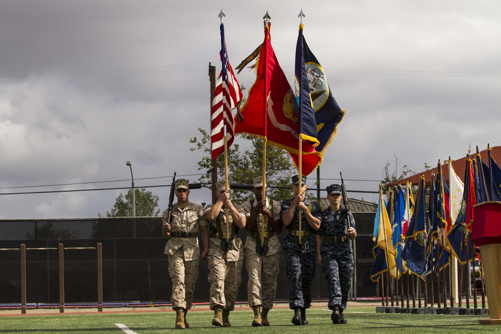 A combined Marine, Sailor color guard marches onto the field May 14 during the opening ceremony of the 2015 Armed Forces Soccer Championship at Marine Corps Air Station Miramar, Calif. Service members from each branch will compete in the championship games.