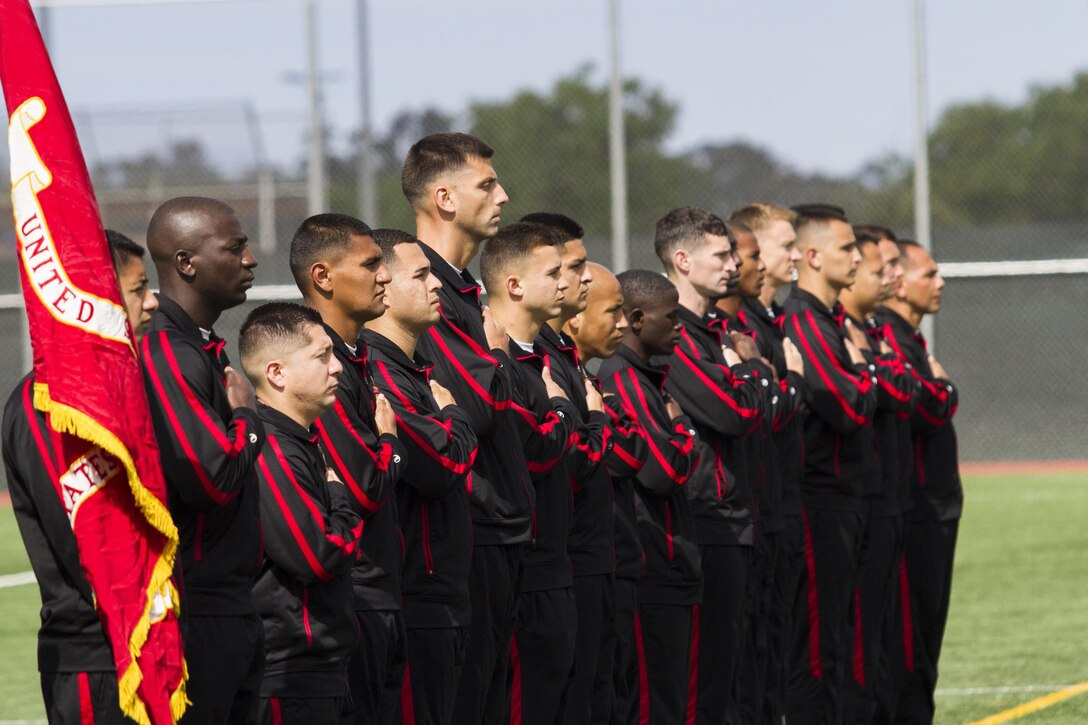 Marines with the All-Marine soccer team place their hands over their hearts while the National Anthem plays during the opening ceremony of the 2015 Armed Forces Soccer Championship May 14 at Marine Corps Air Station Miramar, Calif. The week-long championship tournament will the the Marines against the other branches of the U.S. military.