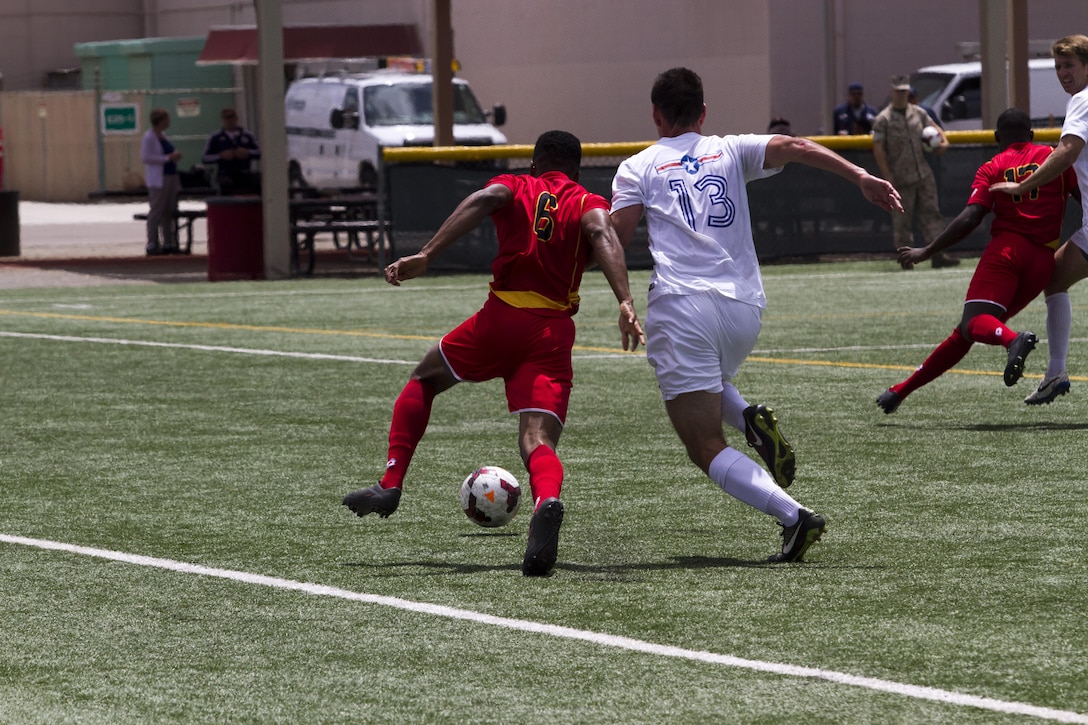 Members of the All-Marine and the Air Force soccer teams fight for the ball May 18 during a 2015 Armed Forces Soccer Championship game at Marine Corps Air Station Miramar, Calif. Representatives from each military branch participated in the championship.