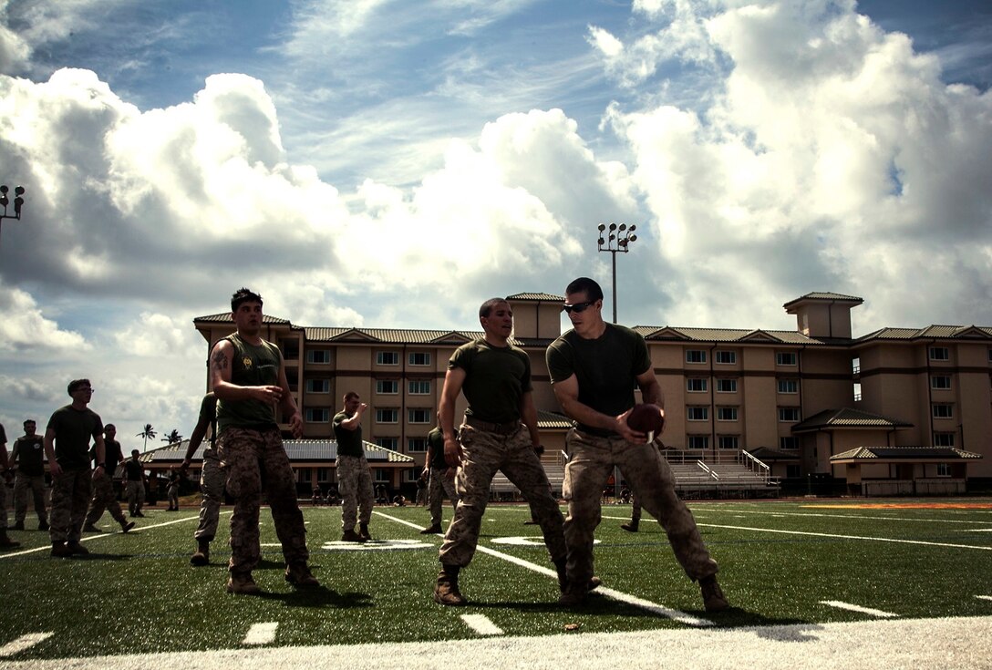 U.S. Marines with Lima Company, Battalion Landing Team 3rd Battalion, 1st Marine Regiment, 15th Marine Expeditionary Unit, compete in an ultimate football game aboard Marine Corps Base, Hawaii, May 19, 2015. The Marines with the 15th MEU are currently on a seven-month deployment through the Pacific and Central Command areas. (U.S. Marine Corps photo by Cpl. Elize McKelvey/Released)