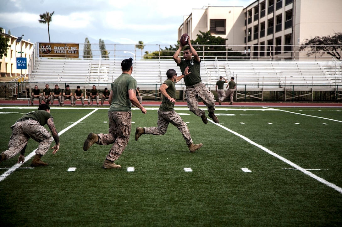 U.S. Marines with Lima Company, Battalion Landing Team 3rd Battalion, 1st Marine Regiment, 15th Marine Expeditionary Unit, compete in an ultimate football game aboard Marine Corps Base, Hawaii, May 19, 2015. The Marines with the 15th MEU are currently on a seven-month deployment through the Pacific and Central Command areas. (U.S. Marine Corps photo by Cpl. Elize McKelvey/Released)
