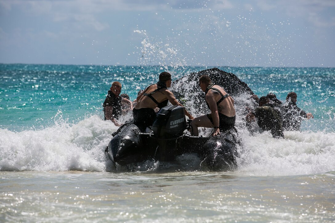 U.S. Marines with the 15th Marine Expeditionary Unit’s Maritime Raid Force practice surf passage procedures aboard Bellows Air Force Station, Hawaii, May 15, 2015. Combat rubber raiding craft give the MRF the ability to quickly and effectively insert onto an objective from the ship to the shore. (U.S. Marine Corps photo by Cpl. Anna Albrecht/Released)