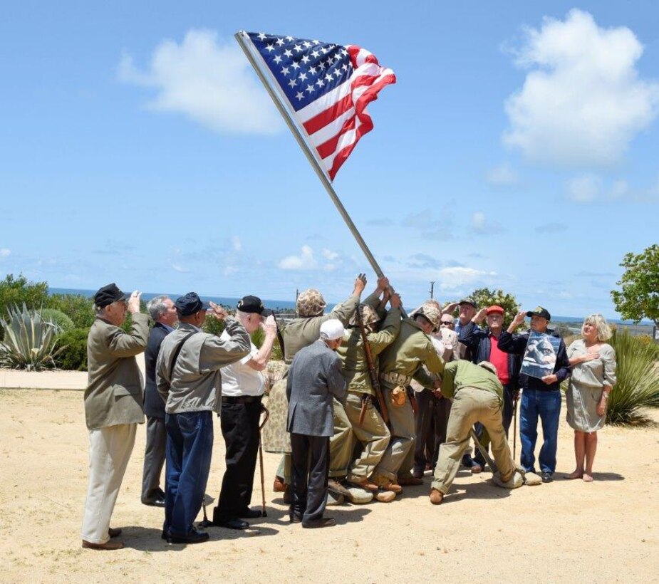 Iwo Jima veterans participate in the reenactment of the historic Mount Suribachi flag raising during an event at the Pacific Views Event Center here, May 22.
 
The event was hosted by Camp Pendleton and Iwo Jima Monument West. Nine veterans of the Battle of Iwo Jima were in attendance to recount their tales of the historic battle, the raising of the flag atop Mount Suribachi and the days that followed.

