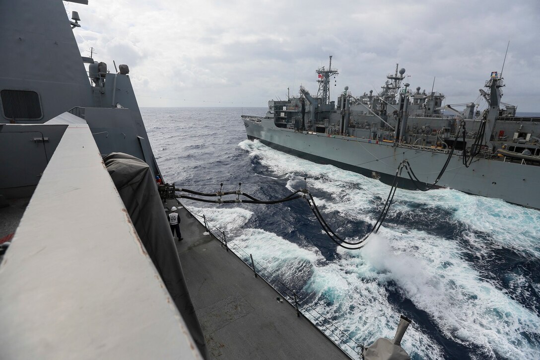 The Marines and Sailors of the 15th Marine Expeditionary Unit and Essex Amphibious Ready Group conduct replenishment at sea with USNS Rainier (T-AOE-7) in the Pacific Ocean aboard the USS Anchorage (LPD 23), May 24, 2015. The USS Anchorage refuels at sea in order to continue its mission without stopping forward progress. (U.S. Marine Corps photo by Cpl. Steve H. Lopez/Released)