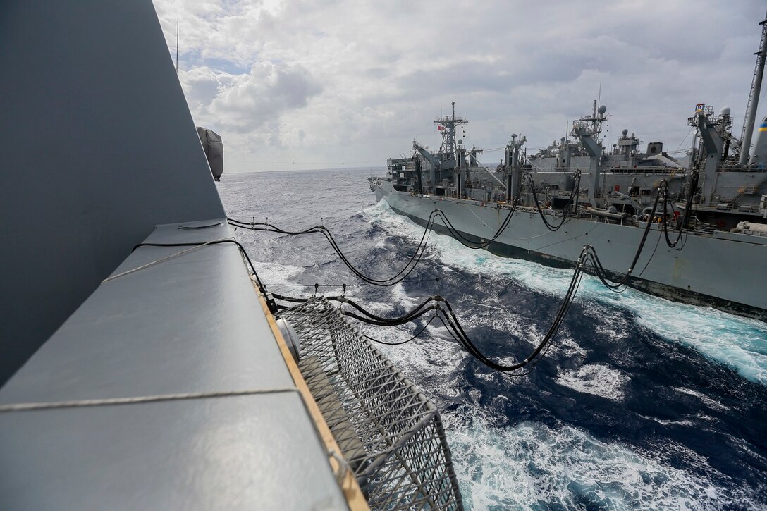 The Marines and Sailors of the 15th Marine Expeditionary Unit and Essex Amphibious Ready Group conduct replenishment at sea with USNS Rainier (T-AOE-7) in the Pacific Ocean aboard the USS Anchorage (LPD 23), May 24, 2015. The USS Anchorage refuels at sea in order to continue its mission without stopping forward progress. (U.S. Marine Corps photo by Cpl. Steve H. Lopez/Released)