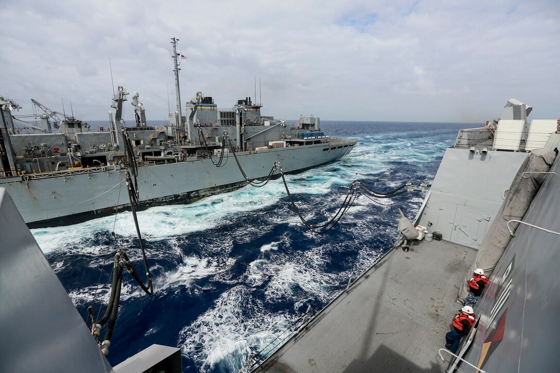 The Marines and Sailors of the 15th Marine Expeditionary Unit and Essex Amphibious Ready Group conduct replenishment at sea with USNS Rainier (T-AOE-7) in the Pacific Ocean aboard the USS Anchorage (LPD 23), May 24, 2015. The USS Anchorage refuels at sea in order to continue its mission without stopping forward progress. (U.S. Marine Corps photo by Cpl. Steve H. Lopez/Released)