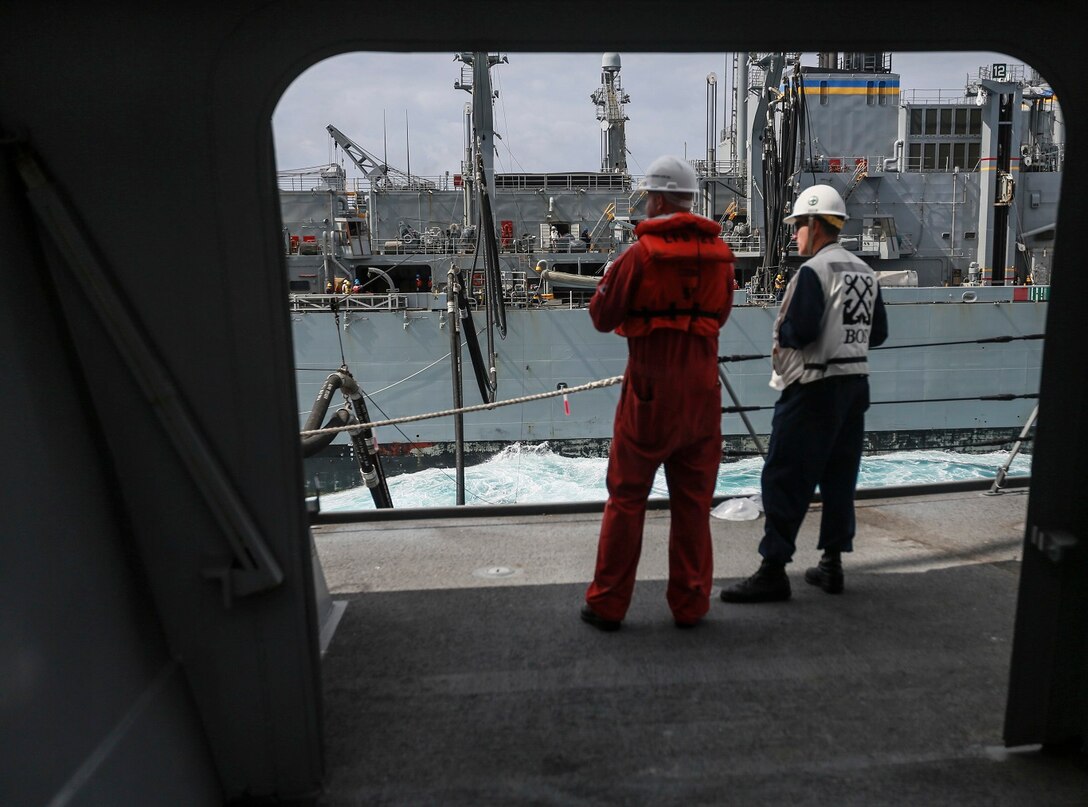 U.S. Navy Sailors with the Essex Amphibious Ready Group supervise a replenishment at sea with USNS Rainier (T-AOE-7) in the Pacific Ocean aboard the USS Anchorage (LPD 23), May 24, 2015. The USS Anchorage refuels at sea in order to continue its mission without stopping forward progress. (U.S. Marine Corps photo by Cpl. Steve H. Lopez/Released)