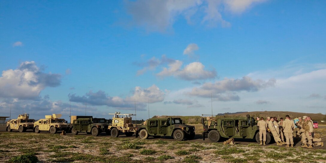 U.S. Marines with Combat Logistics Battalion 15, 15th Marine Expeditionary Unit, stage vehicles prior to a convoy aboard Bellows Air Force Station Hawaii, May 19, 2015. Marines conducted multiple training evolutions in Hawaii to prepare for the remainder of their deployment. (U.S. Marine Corps photo by Cpl. Steve H. Lopez/ Released)