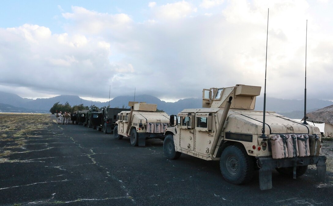 U.S. Marines with Combat Logistics Battalion 15, 15th Marine Expeditionary Unit, stage vehicles prior to a convoy aboard Bellows Air Force Station Hawaii, May 19, 2015. Marines conducted multiple training evolutions in Hawaii to prepare for the remainder of their deployment. (U.S. Marine Corps photo by Cpl. Steve H. Lopez/ Released)