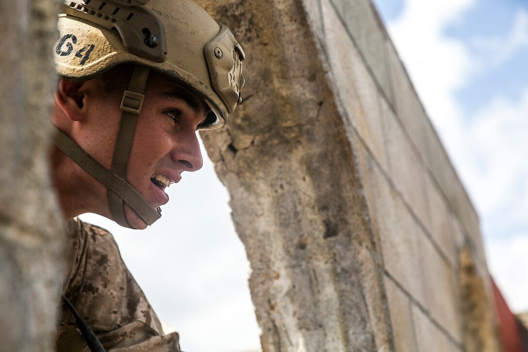 U.S. Marine Cpl. Matthew Jensen participates in a leadership reaction course aboard Marine Corps Base Hawaii, May 18, 2015. Jensen is a member of the 15th Marine Expeditionary Unit’s Maritime Raid Force. The Marines were split into four to five man teams and were given a different challenge to complete at each station. The course is designed to challenge the Marines leadership capabilities by solving obstacles with limited time and equipment. (U.S. Marine Corps photo by Cpl. Anna Albrecht/Released)
