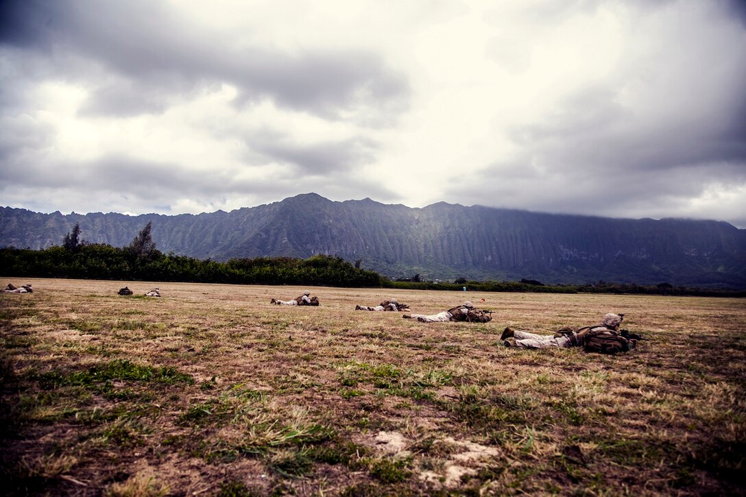 U.S. Marines with Lima Company, Battalion Landing Team 3rd Battalion, 1st Marine Regiment, 15th Marine Expeditionary Unit, establish security aboard Bellows Air Force Station, Hawaii, May 17, 2015. The Marines with the 15th MEU continue to maintain combat readiness during their seven-month deployment through the Pacific and Central Command areas. (U.S. Marine Corps photo by Cpl. Elize McKelvey/Released)