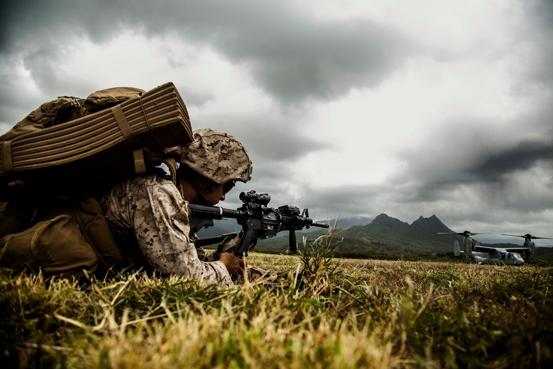A U.S. Marine with Lima Company, Battalion Landing Team 3rd Battalion, 1st Marine Regiment, 15th Marine Expeditionary Unit, establishes security aboard Bellows Air Force Station, Hawaii, May 17, 2015. The Marines with the 15th MEU continue to maintain combat readiness during their seven-month deployment through the Pacific and Central Command areas. (U.S. Marine Corps photo by Cpl. Elize McKelvey/Released)