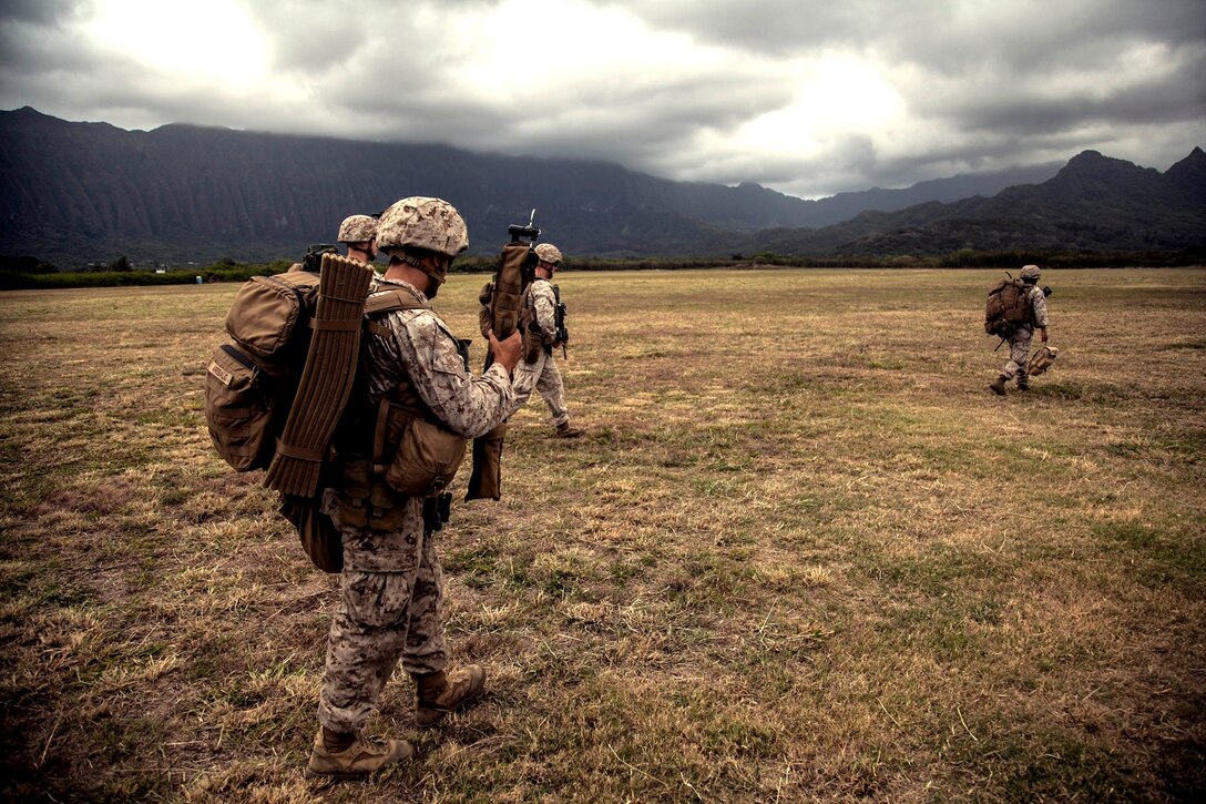 U.S. Marines with Lima Company, Battalion Landing Team 3rd Battalion, 1st Marine Regiment, 15th Marine Expeditionary Unit, patrol aboard Bellows Air Force Station, Hawaii, May 17, 2015. The Marines with the 15th MEU continue to maintain combat readiness during their seven-month deployment through the Pacific and Central Command areas. (U.S. Marine Corps photo by Cpl. Elize McKelvey/Released)