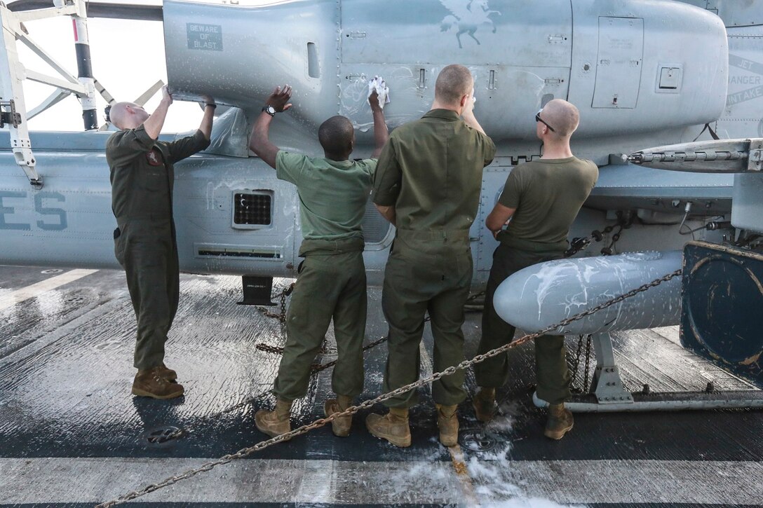 U.S. Marines with Marine Medium Tiltrotor Squadron 161 (Reinforced), 15th Marine Expeditionary Unit, wash an AH-1Z Viper aboard the USS Anchorage (LPD-23) at sea in the Pacific Ocean, May 17, 2015. The Marines of the 15th MEU’s aviation combat element keep their aircraft clean and ready for combat. (U.S. Marine Corps photo by Cpl. Steve H. Lopez/Released)