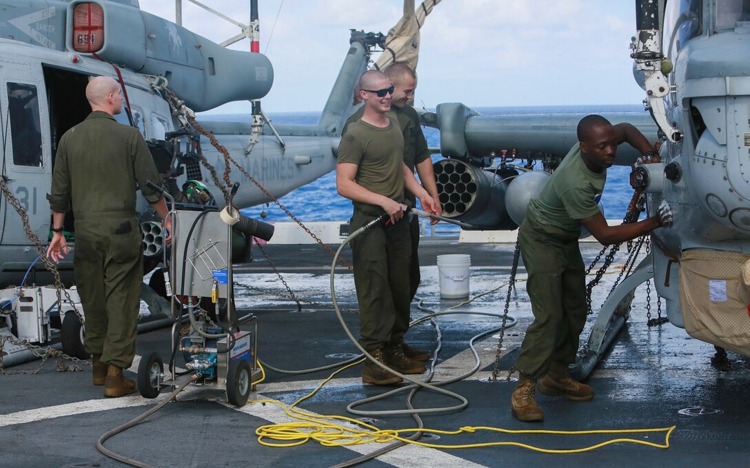 U.S. Marines with Marine Medium Tiltrotor Squadron 161 (Reinforced), 15th Marine Expeditionary Unit, wash an AH-1Z Viper aboard the USS Anchorage (LPD-23) at sea in the Pacific Ocean, May 17, 2015. The Marines of the 15th MEU’s aviation combat element keep their aircraft clean and ready for combat. (U.S. Marine Corps photo by Cpl. Steve H. Lopez/Released)