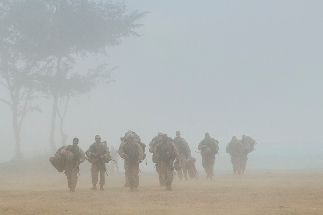 U.S. Marines with Battalion Landing Team 3rd Battalion, 1st Marine Regiment, 15th Marine Expeditionary Unit, off-load from a landing craft, air cushioned during amphibious training aboard Marine Corps Base Hawaii, May 19, 2015. The Marines rehearsed amphibious troop transport using multiple amphibious vehicles. (U.S. Marine Corps photo by Sgt. Emmanuel Ramos/Released)