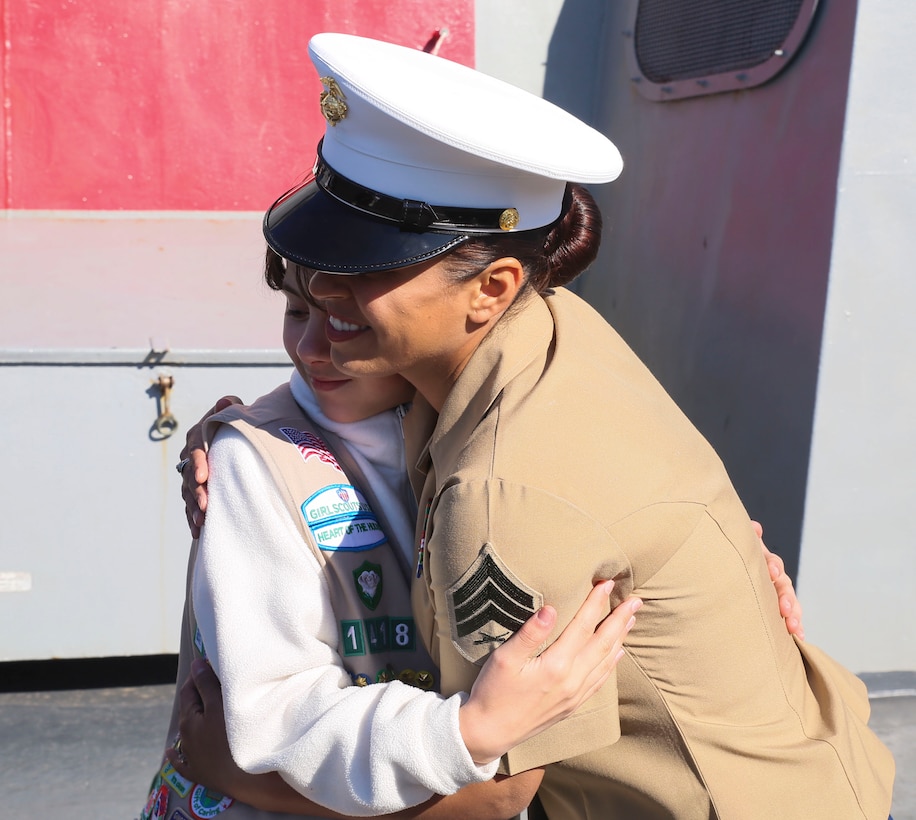Sgt. Jessica Brewer hugs a Girl Scout during their tour on USS San Antonio in New York City, May 23. The tour gave the girls opportunity for one-on-one interactions with U.S. female service members during the 2015 Fleet Week. 
