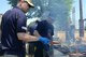 Chief Master Sgt. Paul Elliott, 374th Airlift Wing command chief, grills hamburgers during Airman Appreciation Day at Yokota Air Base, Japan, May 21, 2015. The appreciation day is held once a year at Yokota, and allows leadership to give thanks to Airmen and their families for all their hard work carrying out the mission at Yokota. (U.S. Air Force photo by Airman 1st Class David C. Danford/Released)
