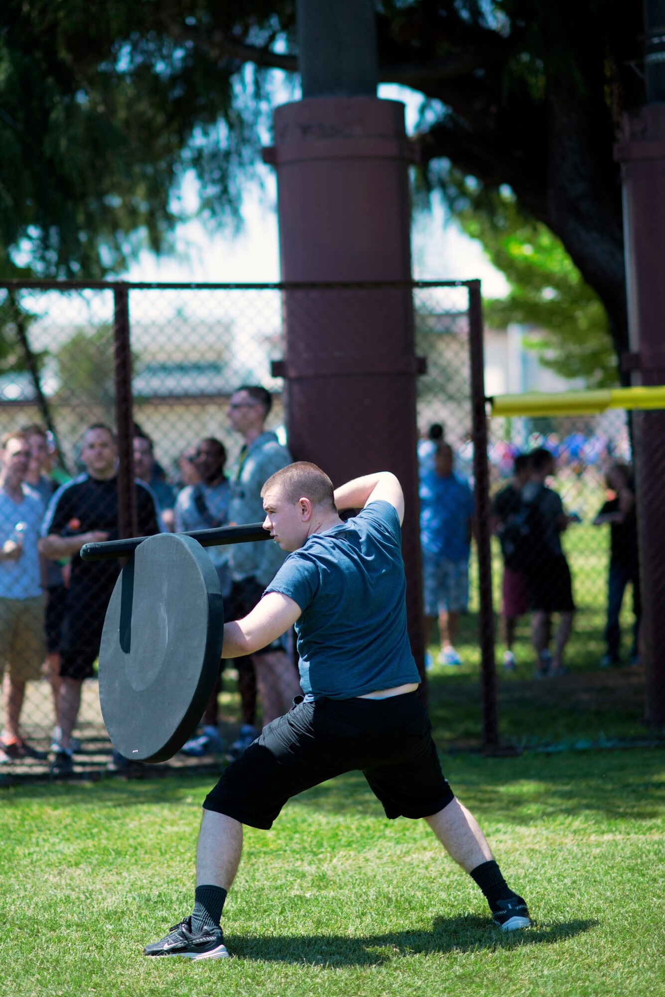 An Airman stands in fighting position during a foam sword and shield fight at Airman Appreciation Day, May 21, 2015 at Yokota Air Base, Japan. Yokota Airmen participated in a variety of games, including flag football, dodgeball and volleyball. (U.S. Air Force photo by Airman 1st Class Delano Scott/Released)