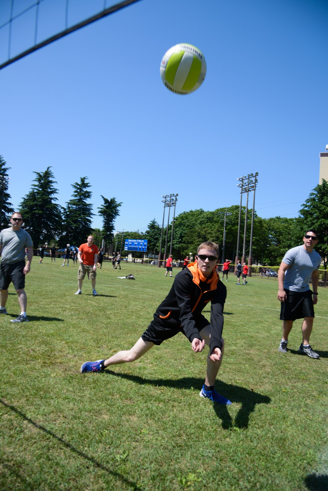 Steven Redvay, 374th Medical Support Squadron, prepares to hit the ball during a volleyball game against the 374th American Forces Network team May 21, 2015, during Airman Appreciation Day at Yokota Air Base, Japan. MDSS won the match 3-2. (U.S. Air Force photo by Senior Airman David Owsianka/Released)