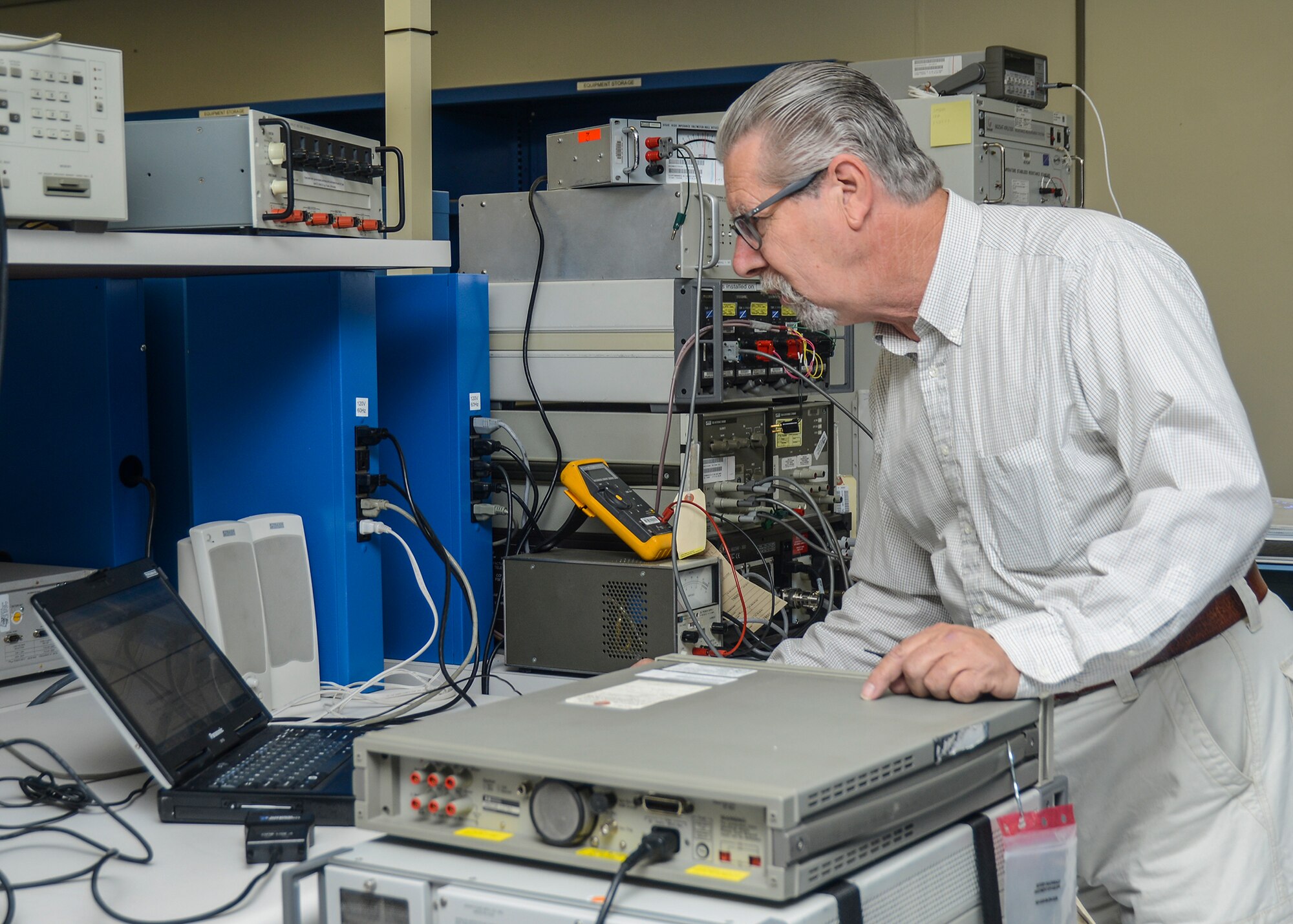 Paul Breedveld, Precision Measurement Equipment Laboratory mechanic, calibrates a 3458 multimeter. (U.S. Air Force photo by Rebecca Amber)