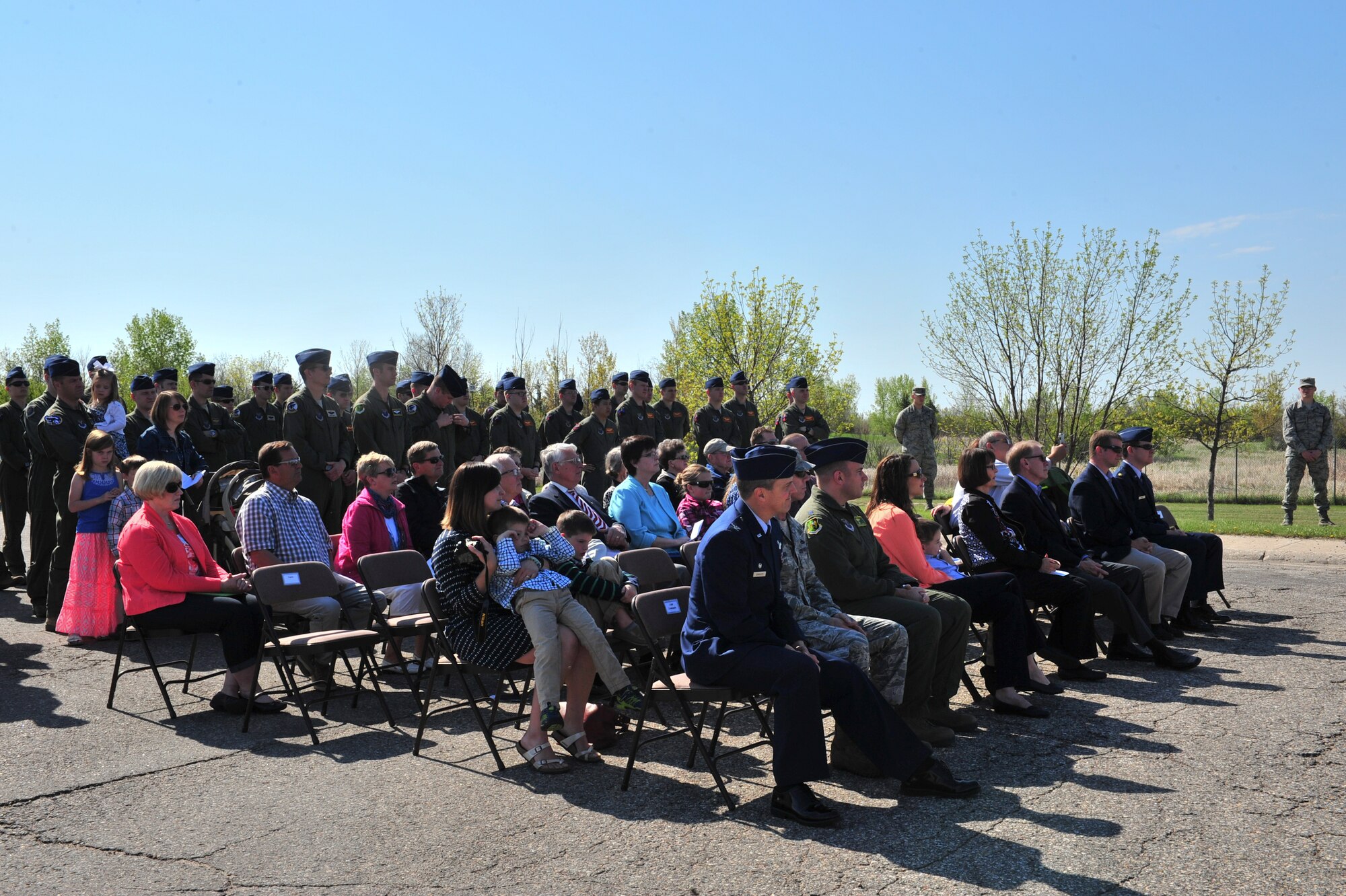 Family, friends and Minot leadership attend a dedication ceremony for Capt. Eric Schmidt on Minot Air Force Base, N.D., May 21, 2015. The aircraft was dedicated to Schmidt because of his love for aircraft, his love of flying and his diligence to take care of those around him. (U.S. Air Force photo/Senior Airman Malia Jenkins)
