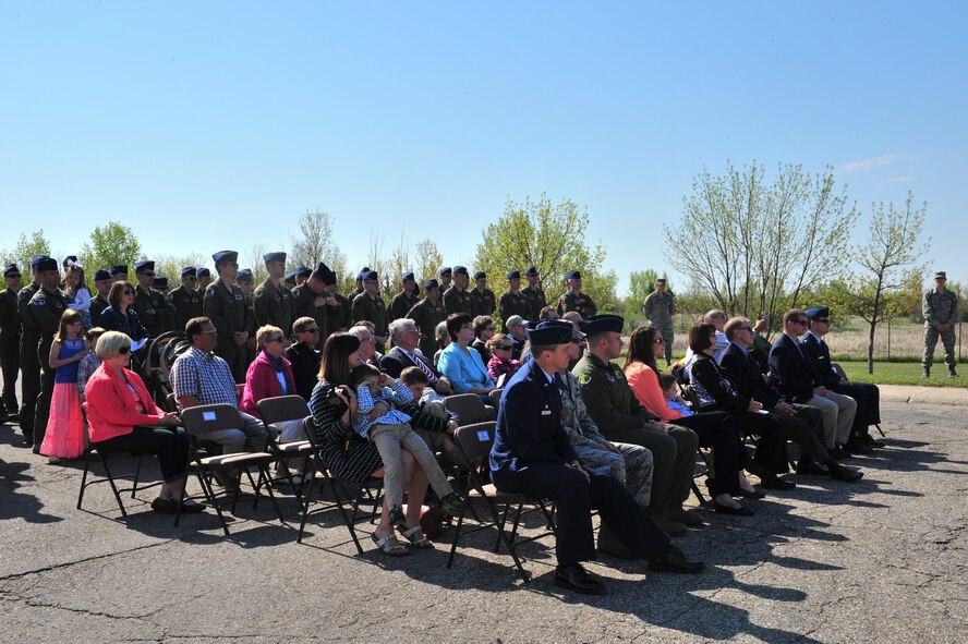 Family, friends and Minot leadership attend a dedication ceremony for Capt. Eric Schmidt on Minot Air Force Base, N.D., May 21, 2015. The aircraft was dedicated to Schmidt because of his love for aircraft, his love of flying and his diligence to take care of those around him. (U.S. Air Force photo/Senior Airman Malia Jenkins)