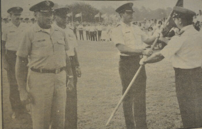 Maj. Gen. Donald A. Logeais (right) passes the 17th MAS flag to Lt Col. Michael Wooley as Lt. Col. (Ret) Edwin Green, former 17th MAS commander looks on. (U.S. Air Force photo / Staff Sgt. Ron Brotherton)