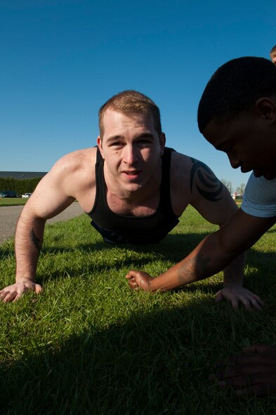 Senior Airman Joseph Rodland, 5th Security Forces Squadron defender, completes the push up portion of the Security Forces Survivors Challenge on Minot Air Force Base, N.D., May 20, 2015. The Survivors Challenge pushed Airmen to their physical limits. (U.S. Air Force photo/Airman 1st Class Christian Sullivan)