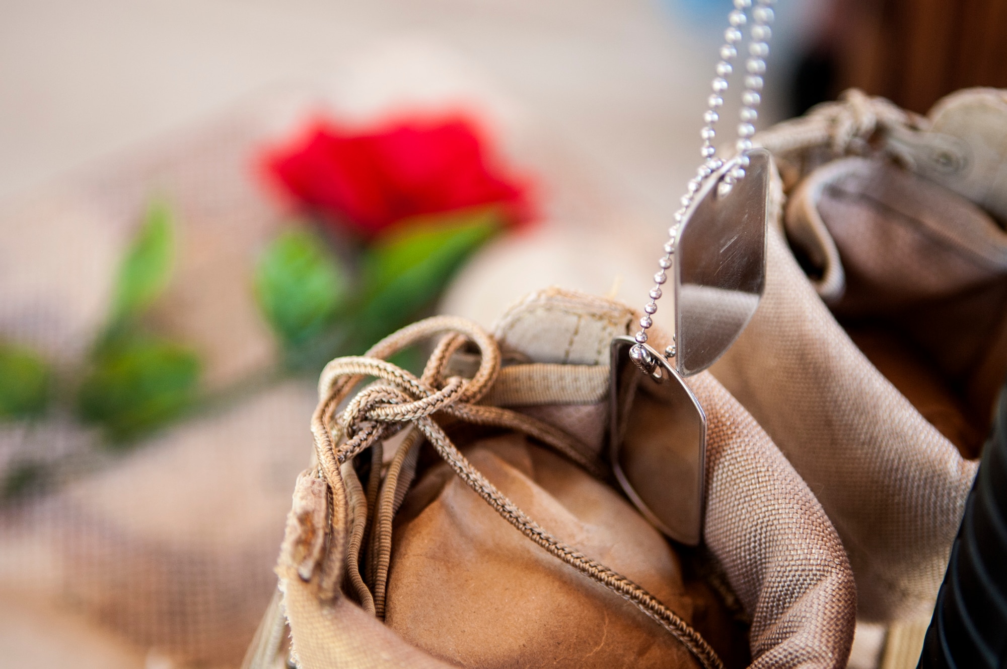 A pair of blank dog tags hang from a battlefield cross on display during a Memorial Day ceremony, May 25, 2015, in Goldsboro, North Carolina. The battlefield cross presentation is a tradition that began during the Civil War and continues today to show respect for fallen service members. (U.S. Air Force photo/Airman Shawna L. Keyes) 