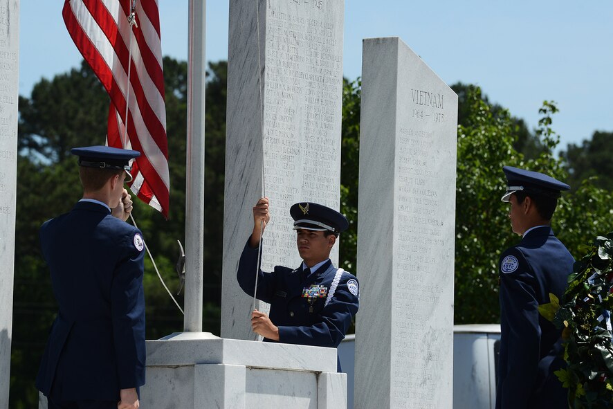 Junior Reserve Officers’ Training Corps cadets raise the U.S. flag during a Memorial Day ceremony at the Mabry Memorial in Sumter, South Carolina, May 25, 2015. On Memorial Day, U.S. flags are flown at half-staff from sunrise until noon, and then raised to the top of the staff from noon until sunset to honor the nation’s combat heroes. (U.S. Air Force photo by Senior Airman Diana M. Cossaboom/Released)