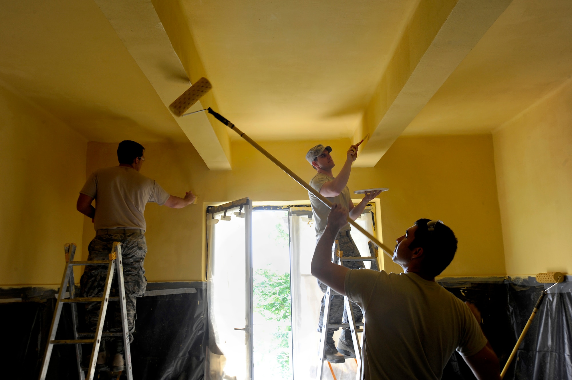 Oregon Air National Guard Airmen assigned to the 142nd Fighter Wing Civil engineer squadron work together to paint clinical treatment rooms at a medical facility in the city of Mangalia, Romania, May 18, 2015, as part of the U.S. European Command’s (EUCOM) Humanitarian Civic Assistance Program (HCA). The EUCOM HCA program is designed to improve the host nation's critical infrastructure and the underlying living conditions of the civilian populace. (U.S. Air National Guard photo by Tech. Sgt. John Hughel, 142nd Fighter Wing Public Affairs/Released)
