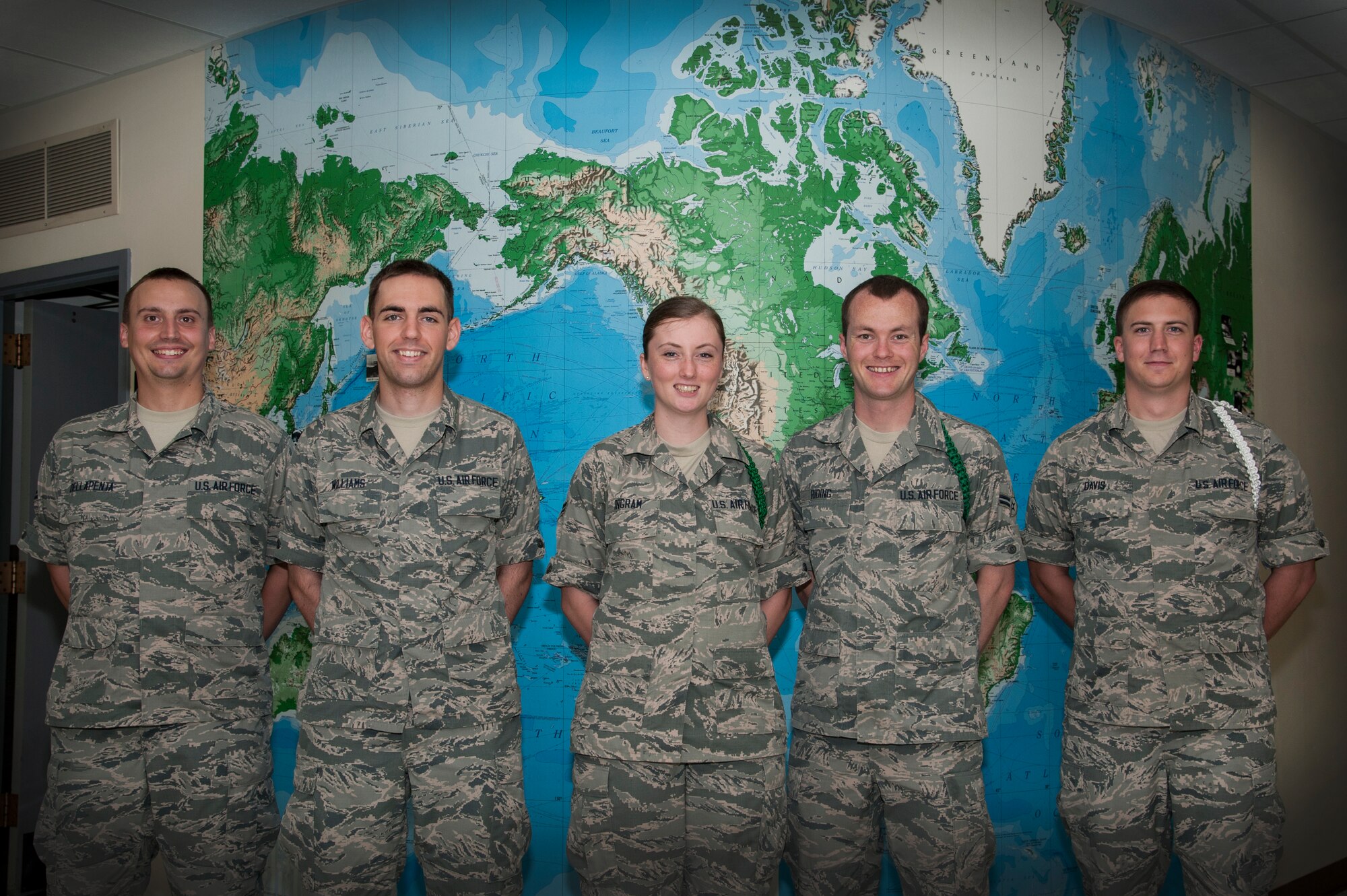 312th Training Squadron students pose for a photo at the 17th Training Group building on Goodfellow Air Force Base, Texas, May 26, 2015. The Special Instruments Training students received letters of appreciation for their participation and support of the Month of the Military Child event at the Youth Center. (U.S. Air Force photo by Senior Airman Michael Smith/Released)