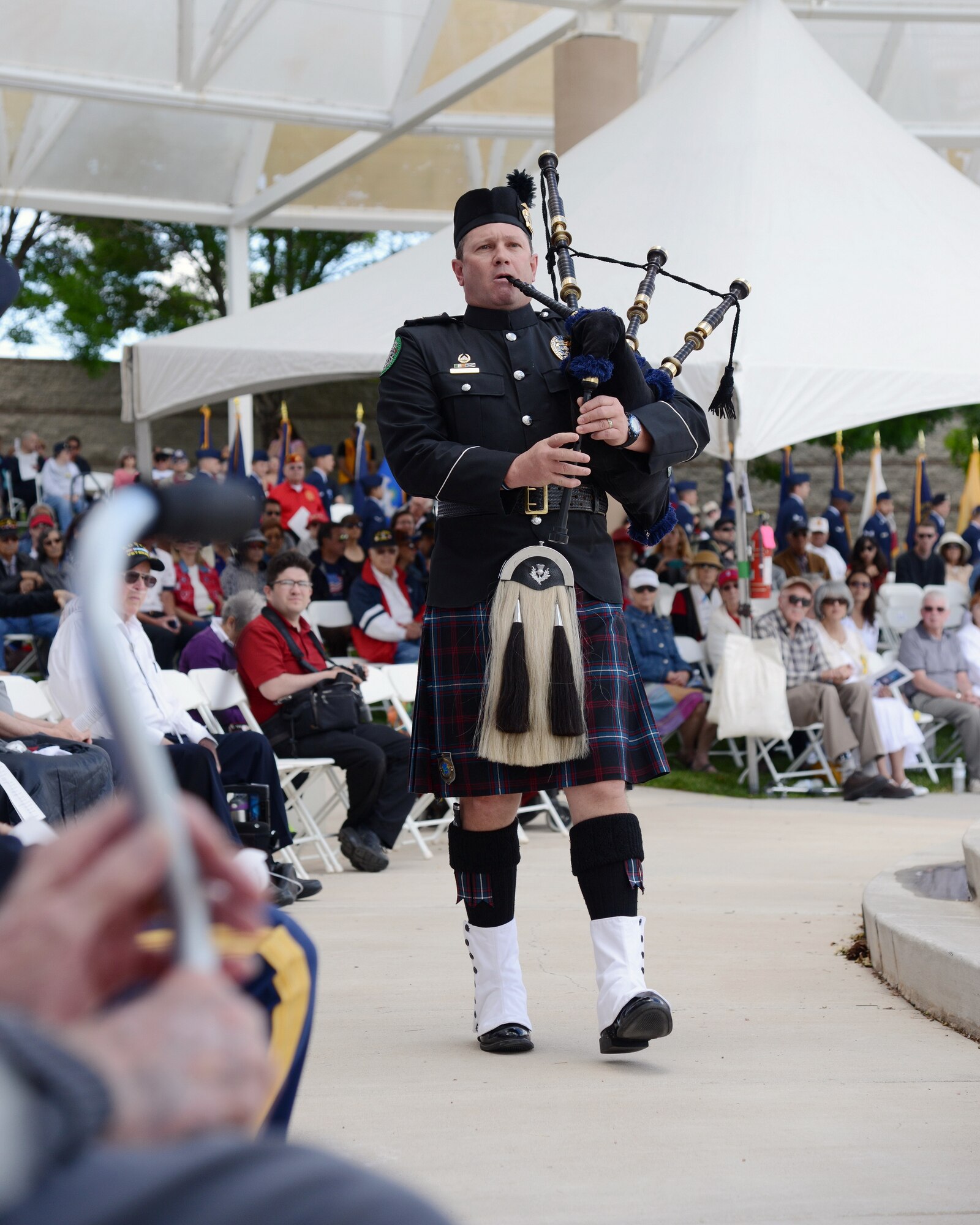 A musician plays the bagpipes at a Memorial Day ceremony recognizing fallen military members May 25. (Photo by Jamie Burnett)
