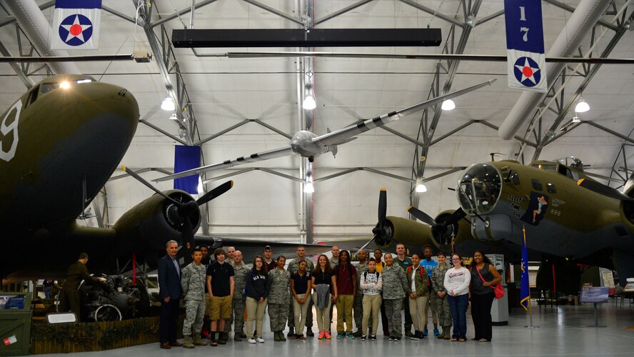 Mentors from Dover’s Top III and Communities In Schools program pose for a photo with their mentees from Milford High School May 21, 2015, at the Air Mobility Command Museum on Dover Air Force Base, Del. CIS of Delaware currently provides direct support services to approximately 1,500 children and youth who are at risk of low academic performance and dropping out of school. (U.S. Air Force photo/Airman 1st Class William Johnson)