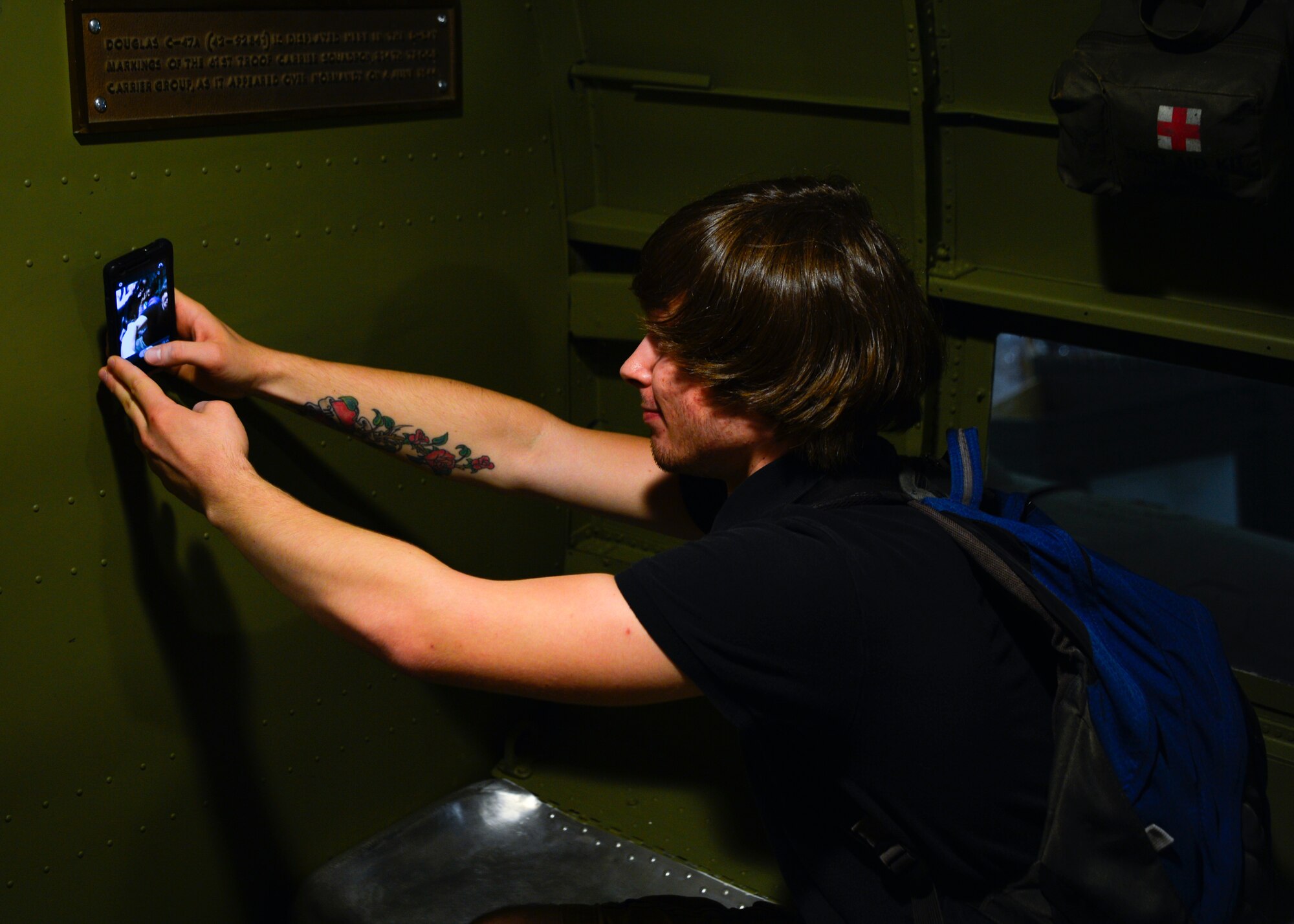 Kenny Nicholson, Milford High School 11th Grader, takes a selfie inside of a C-47A Skytrain May 21, 2015, during a tour of the Air Mobility Command Museum on Dover Air Force Base, Del. Nicholson is enrolled in the Communities In Schools program and meets with his mentor once a month at Dover AFB to observe how Airmen operate in their work places. (U.S. Air Force photo/Airman 1st Class William Johnson)