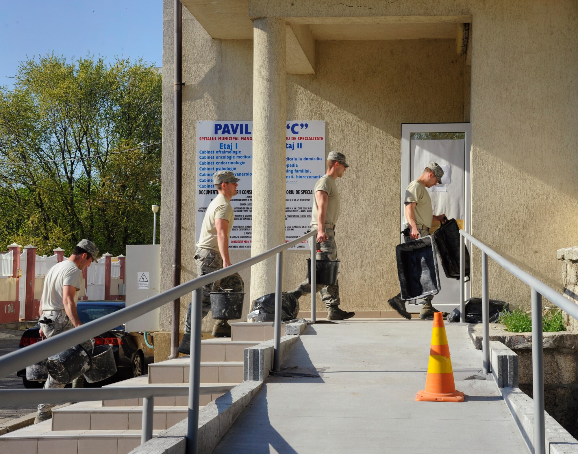 Airmen from the Oregon Air National Guard’s 142nd Fighter Wing return construction equipment back to the job site as the close of workday, May 9, 2015, at a medical facility in the city of Mangalia, Romania, as part of the U.S. European Command’s (EUCOM) Humanitarian Civic Assistance Program (HCA). The EUCOM HCA program is designed to improve the host nation's critical infrastructure and the underlying living conditions of the civilian populace. (U.S. Air National Guard photo by Tech. Sgt. John Hughel, 142nd Fighter Wing Public Affairs/Released)