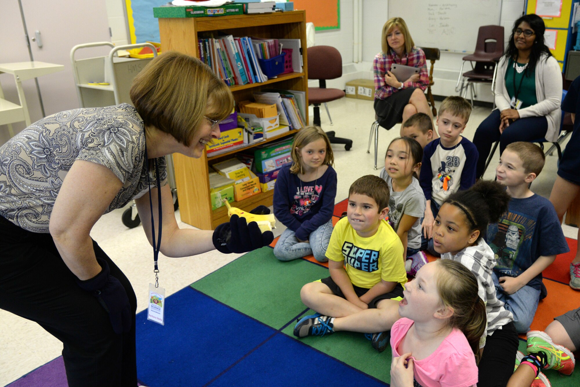 Barbara Stella, Traveling Science Workshop educator, teaches Hanscom Primary School second graders about physical changes of matter during a workshop at the school May 20. The Discovery Museums' Traveling Science Workshops, launched in 1992, serve more than 27,000 students each year through a set of 17 topics that support Massachusetts state curriculum standards and Science, Technology, Engineering and Math, or STEM, initiatives. (U.S. Air Force photo by Linda LaBonte Britt)
