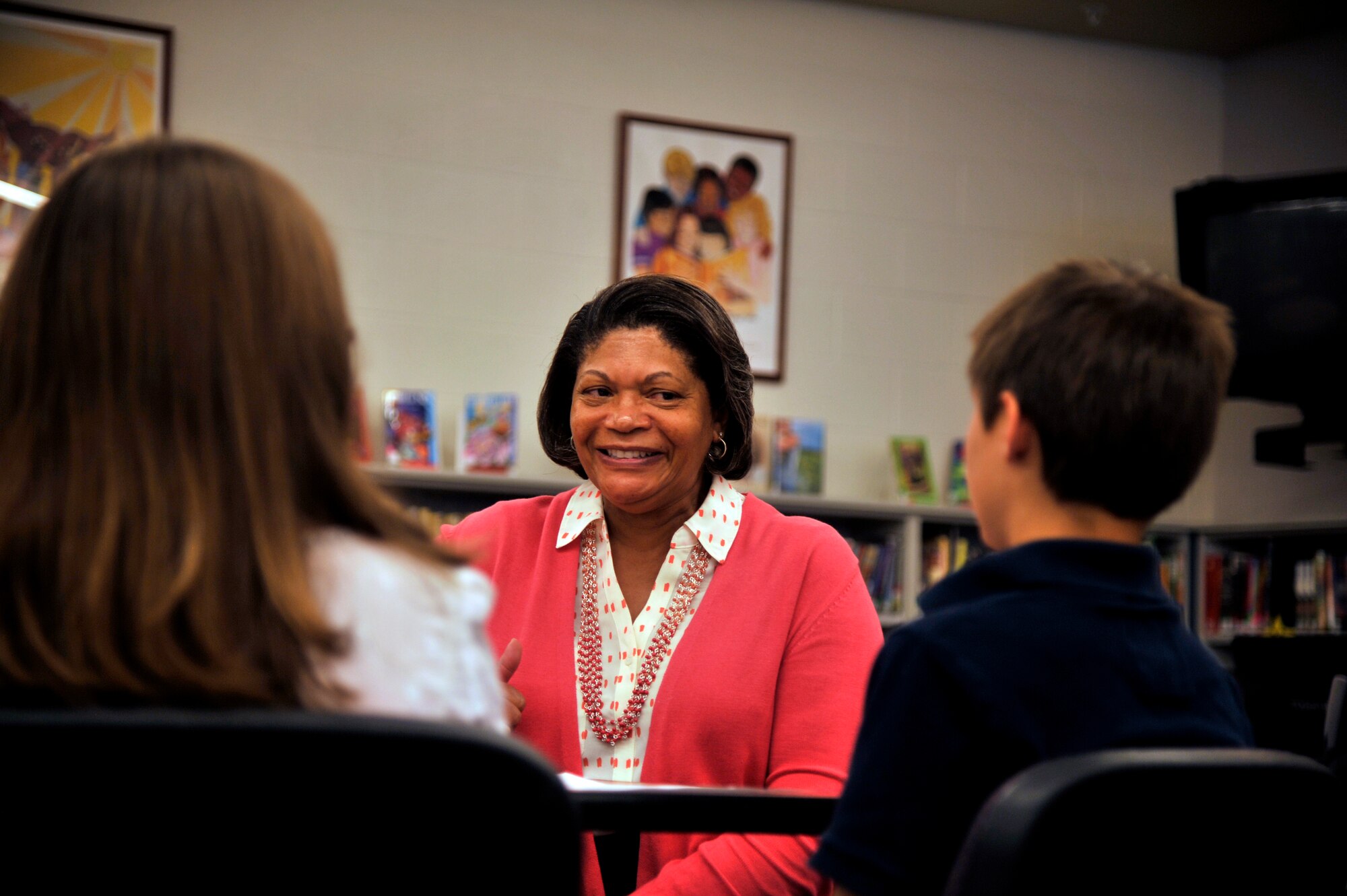 Evelyn McDew, wife of Air Mobility Command commander, Gen. Darren McDew, speaks with two Michael Anderson Elementary School associated student body members May 21, 2015, in Michael Anderson Elementary School at Fairchild Air Force Base, Wash. Mrs. McDew spoke with the students to learn more about how they felt about being a military child. Mrs. McDew met with the students was to ask if they had any concerns and ensure their needs being met. (U.S. Air Force photo/Airman 1st Class Taylor Bourgeous)