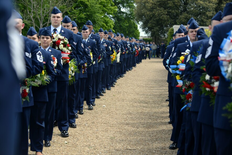 RAF Mildenhall Airmen standby with their respective wreaths at the Cambridge American Cemetery and Memorial May 25, 2015, in Cambridge, England. The annual ceremony is held in remembrance of service members who lost their lives during World War II. (U.S. Air Force photo by Senior Airman Christine Halan/Released)